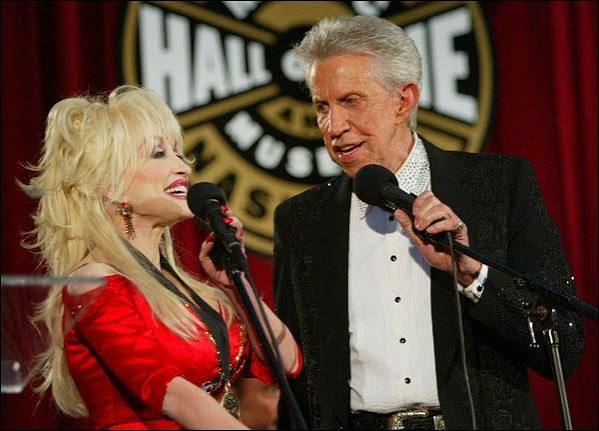 Porter Wagoner and Dolly Parton singing together at the Country Music Hall of Fame and Museum